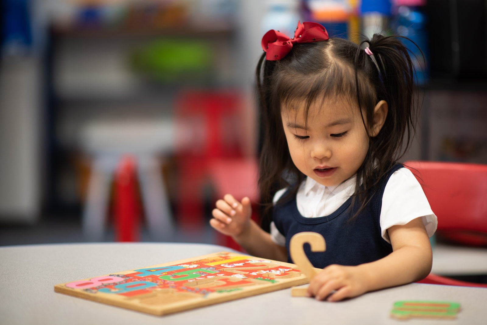 Preschool student working on puzzle