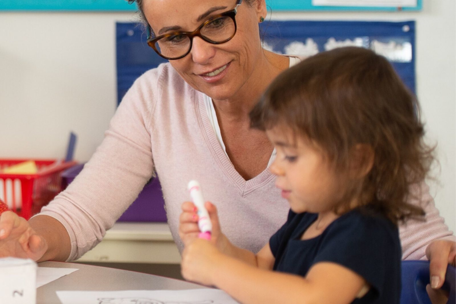 Preschool girl with teacher