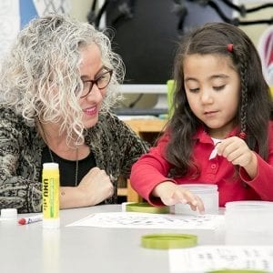 junior kindergarten girl with teacher